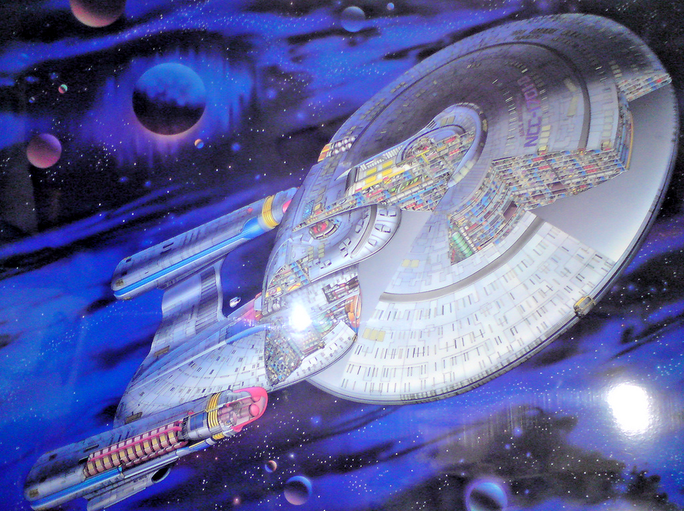 Starship Enterprise flying through space.