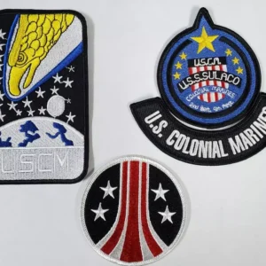 Three embroidered patches: space, military, and stars.